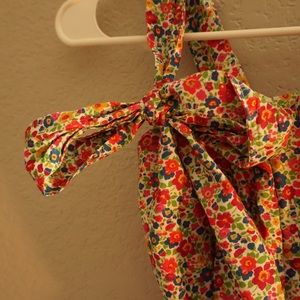 Mini floral dress, sweet ties for straps and a stylish bow around the waist.